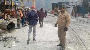 Security personnel at the Pipalkoti tunnel site after loco–goods train collision in Chamoli.
