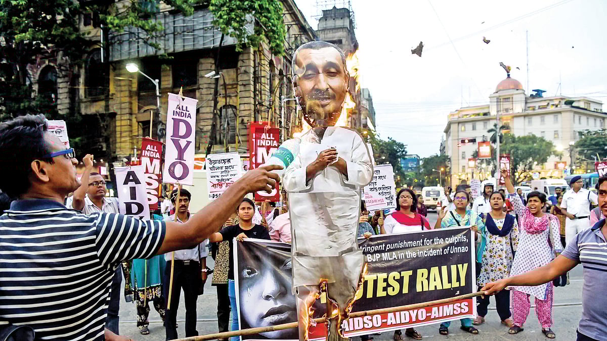 Protesters burn an effigy of Kuldeep Singh Sengar demanding justice for the Unnao rape survivor