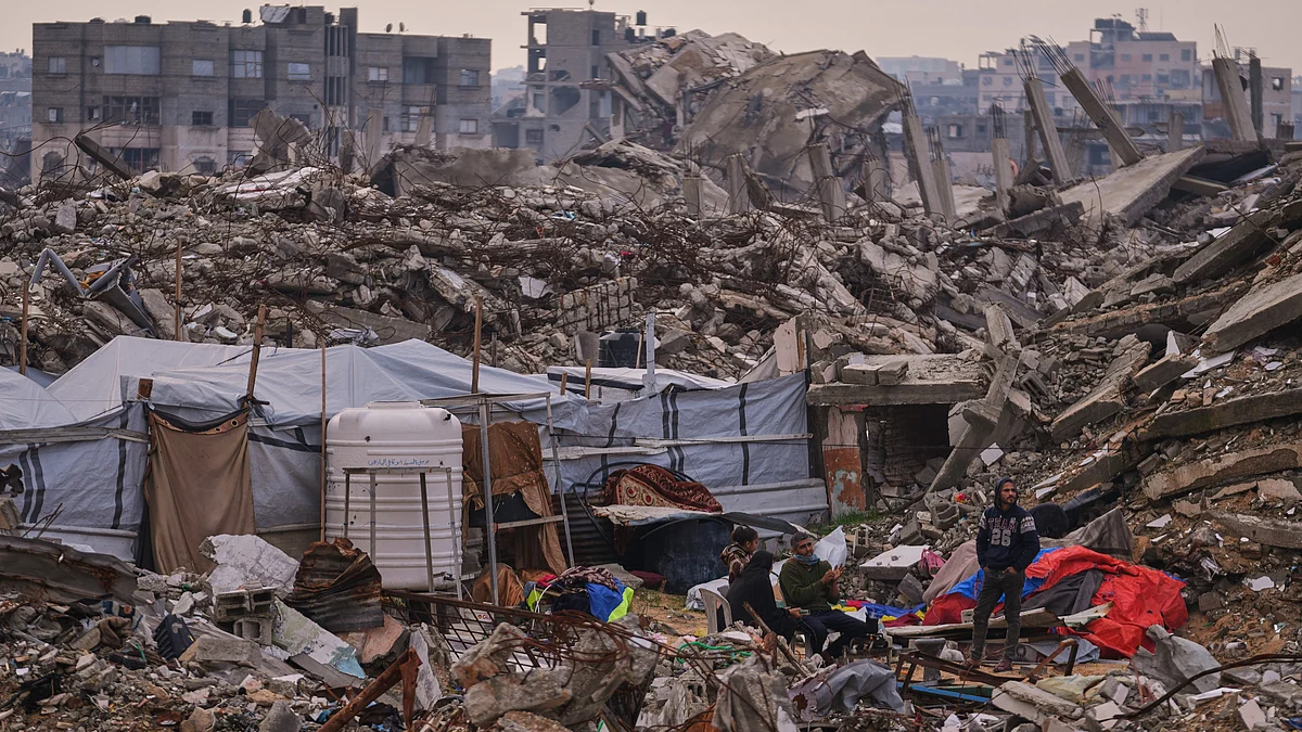 A tent rises from the rubble of homes destroyed in Israeli air and ground strikes in Gaza City.