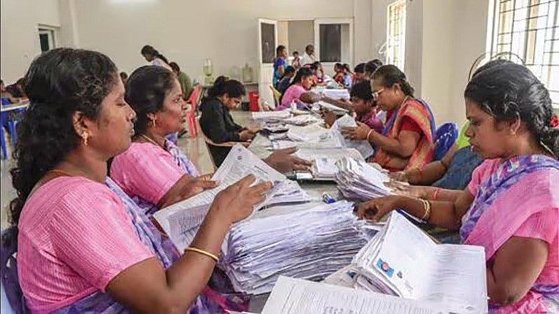Election staff sifting through forms during the SIR in Tamil Nadu
