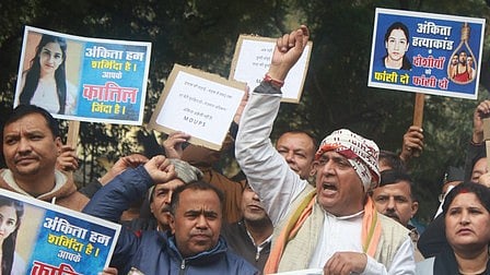 Demonstrators express outrage over the 2022 killing