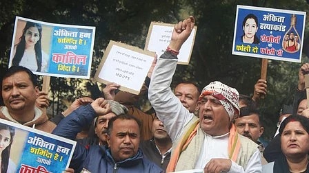 Demonstrators express outrage over the 2022 killing