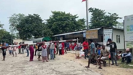 People gather along the Nepal border amid heightened security and surveillance.
