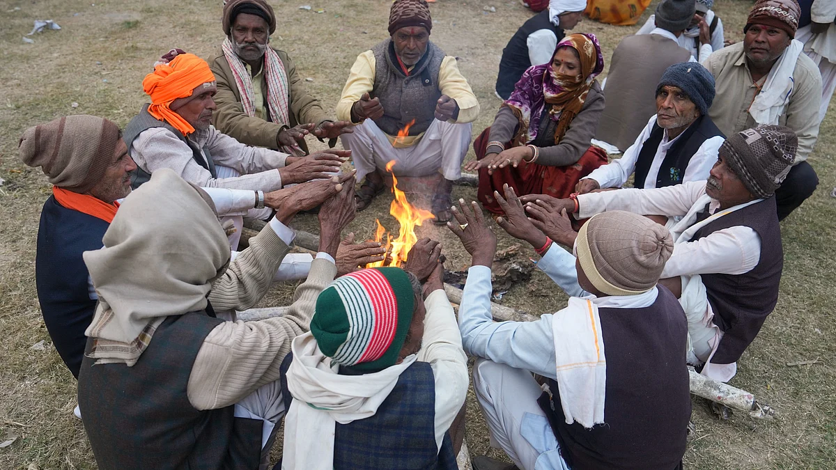 People huddle around a fire during the biting cold in Kolkata.