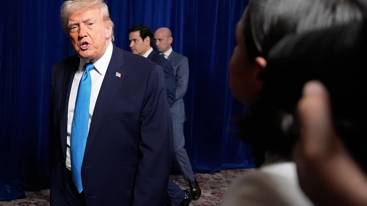 Donald Trump leaves the podium after addressing reporters at his Mar-a-Lago estate in Florida.