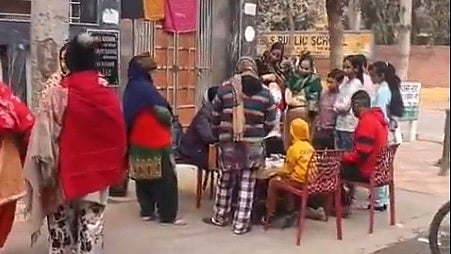 Screengrab of local video showing doctors examining Delta 1 residents 