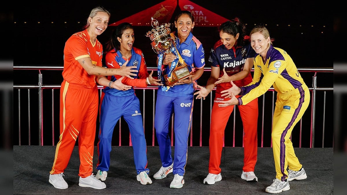 Up for grabs: WPL captains strike a pose with the winners' trophy