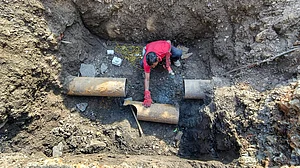 A civic worker during restoration of Narmada water pipelines in Indore.