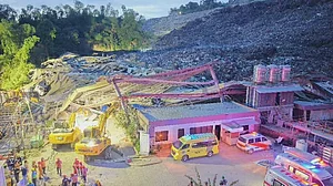 Workers were feared buried under a mountain of waste