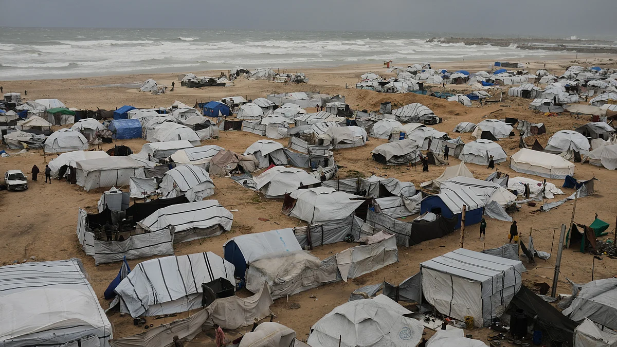 Storm clouds gather over a beachside displacement camp in Gaza City.