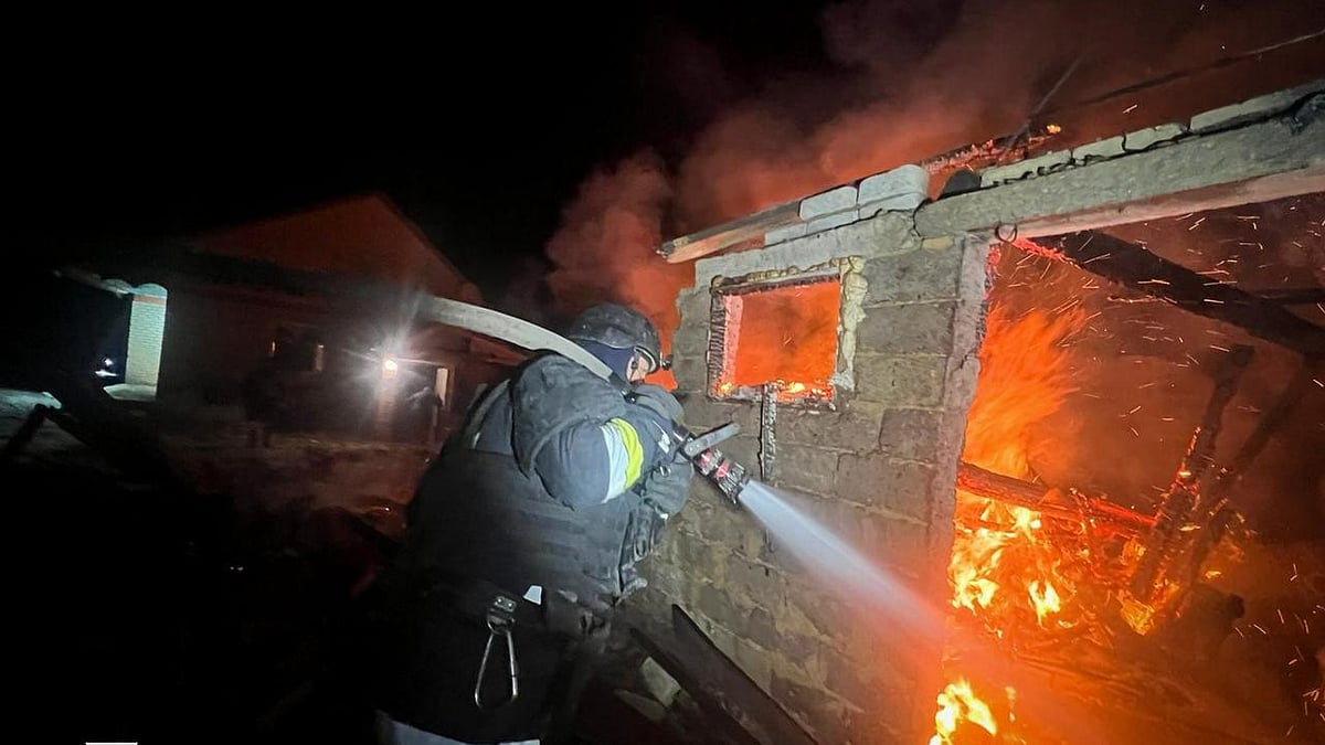 A firefighter at an energy facility after a Russian strike