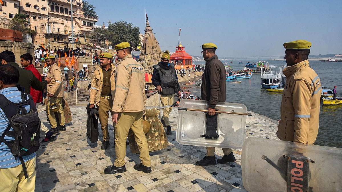 Police stand guard at Manikarnika Ghat.
