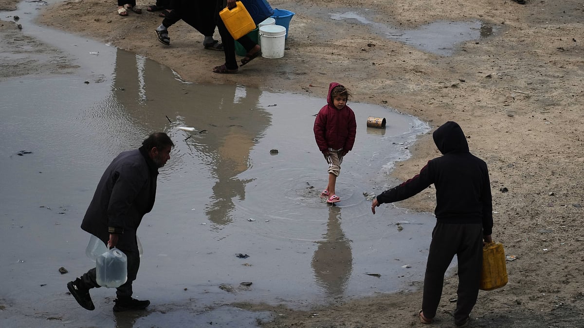 Palestinians struggle through stormy weather in Gaza City.