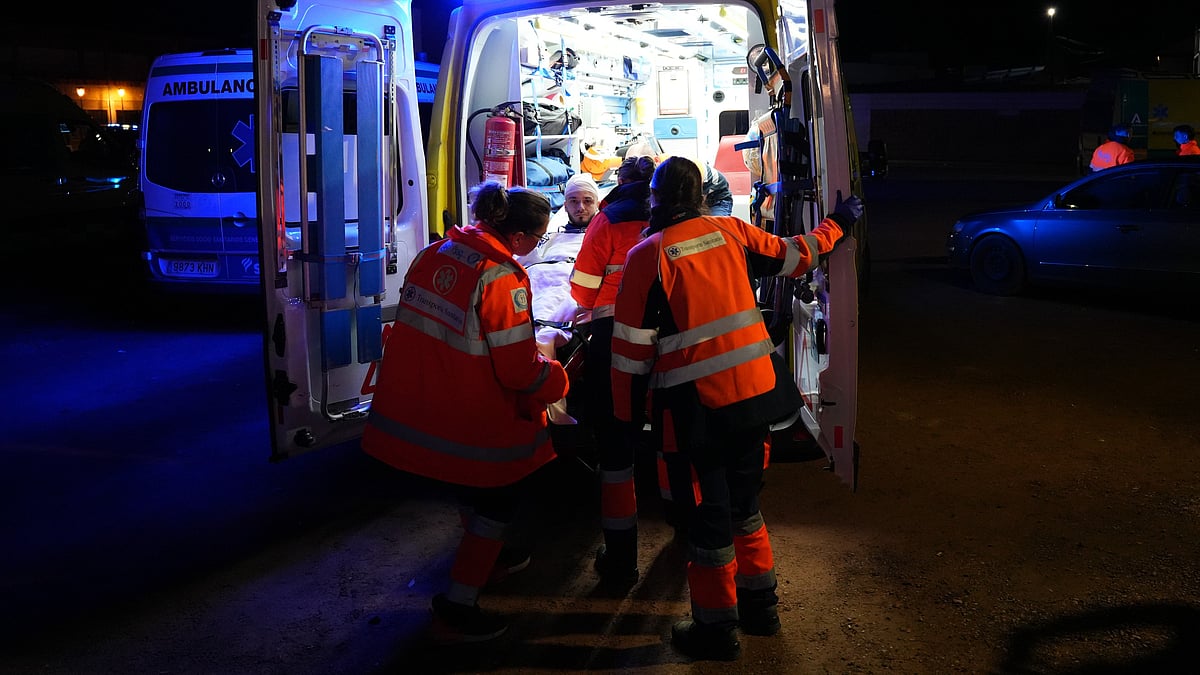 An injured survivor is transported by ambulance in Adamuz.