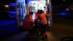 An injured survivor is transported by ambulance in Adamuz.