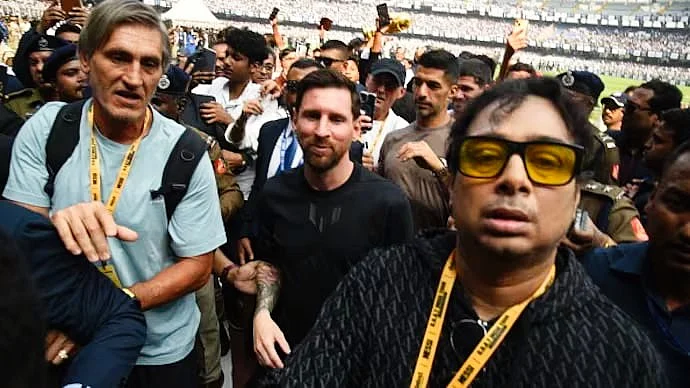 Satadru Dutta (forground) with Leo Messi at Salt Lake Stadium