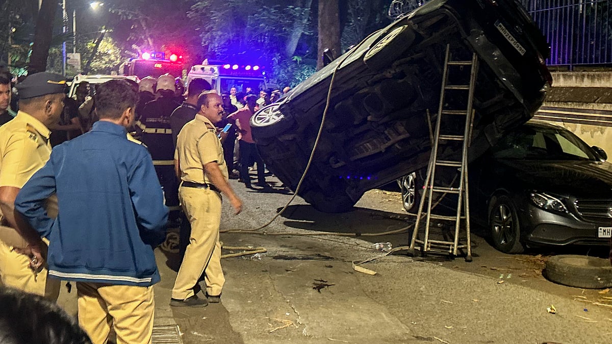 Security personnel at the scene after an auto-rickshaw hit Akshay Kumar’s escort vehicle in Mumbai.