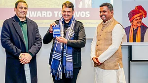 Devendra Fadnavis accepts the WEF badge at Davos