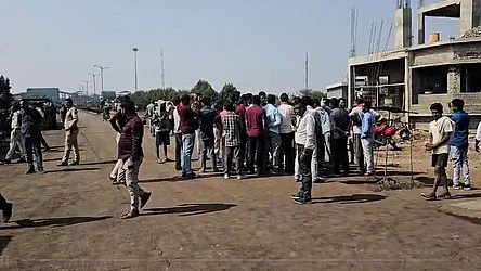 People gather near the steel plant in Chhattisgarh.