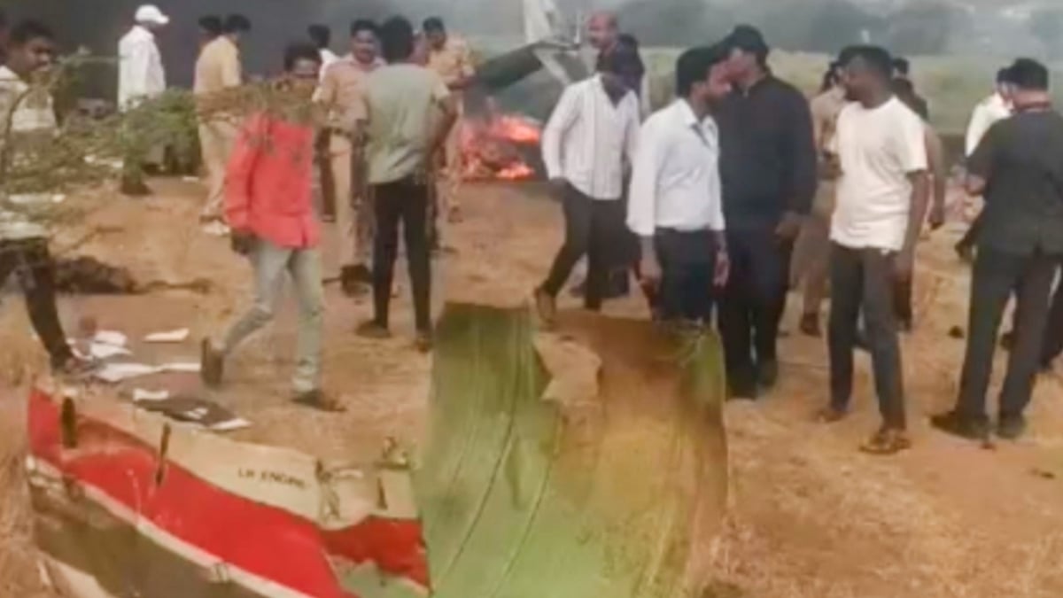 Locals gather at the crash site in Baramati, Pune.