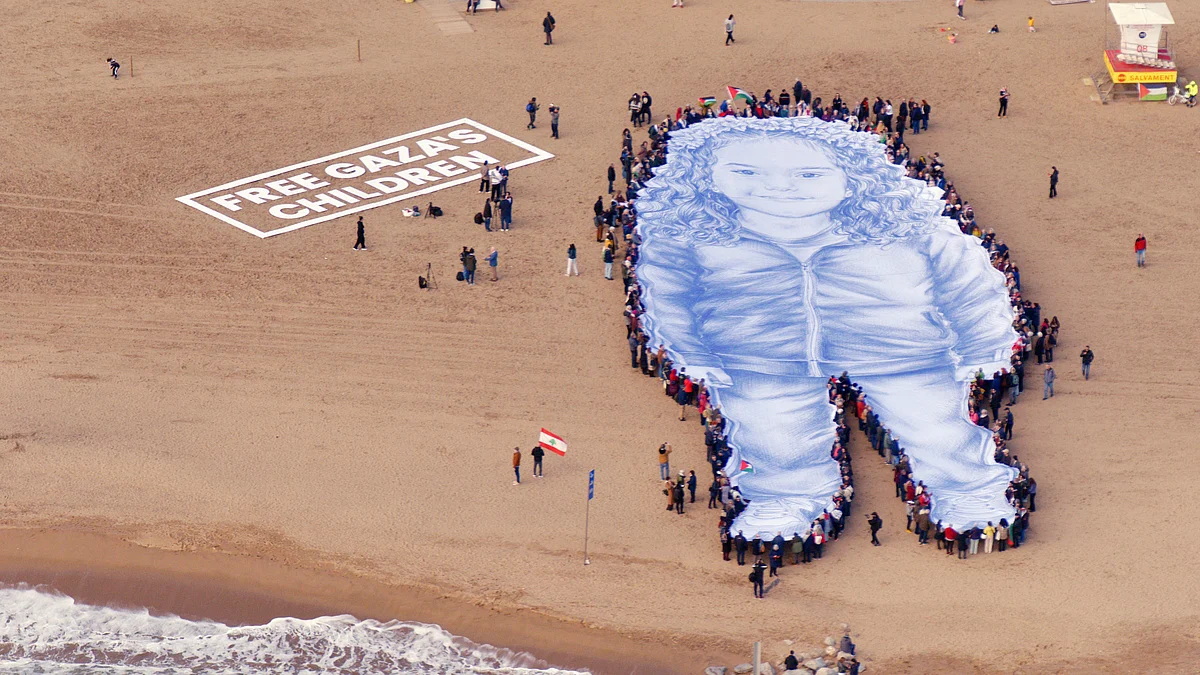 A giant portrait of Hind Rajab on a Barcelona beach highlights calls to protect Gaza’s children.