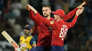 Harry Brook (back to camera) and Will Jacks celebrate the fall of a Lankan wicket during last series.