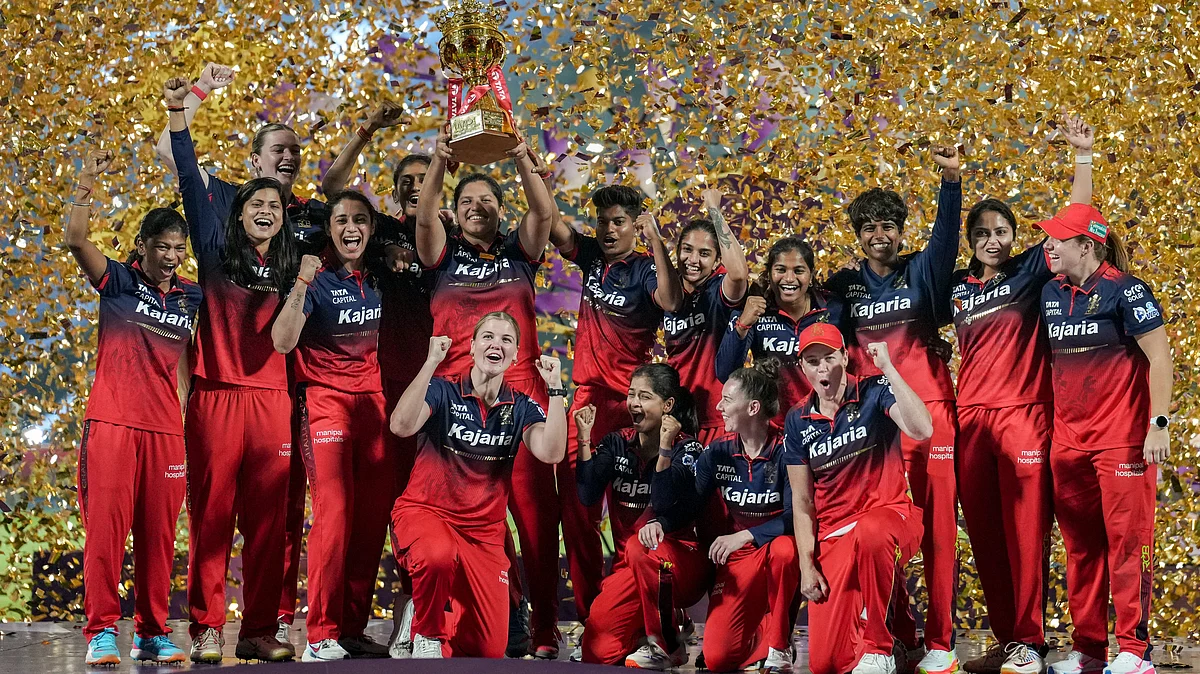 RCB celebrate with the trophy after winning WPL 2026 final against DC at BCA Stadium in Vadodara.