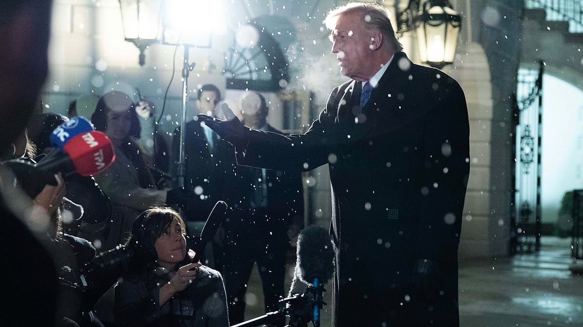 Donald Trump speaks to reporters on South Lawn.