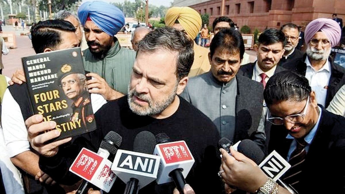 Lok Sabha Leader of the Opposition Rahul Gandhi shows a copy of the book that apparently does not exist