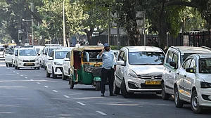 App-based taxis and autorickshaws line up along a roadside during a drivers’ protest in New Delhi.
