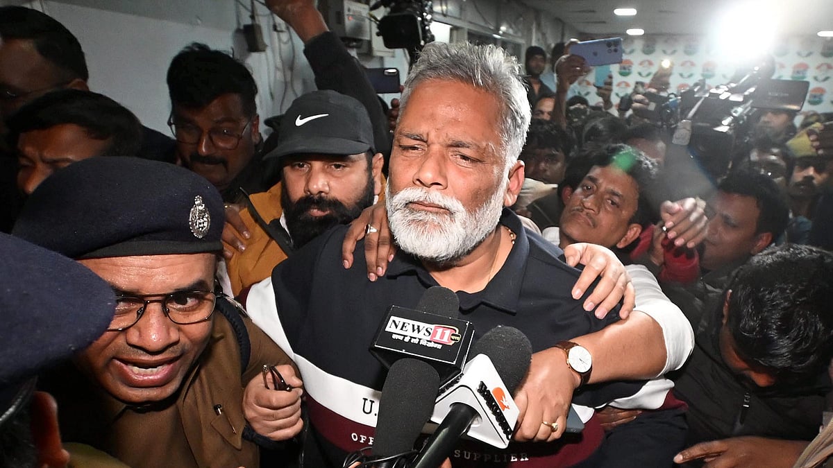 Bihar MP Pappu Yadav, being arrested by police personnel from his residence.