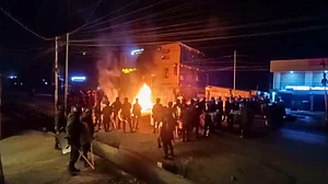 Security personnel and agitators during a protest rally in Churachandpur.