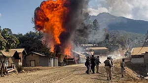 Smoke and flames rise as armed miscreants allegedly torch houses in Ukhrul district.