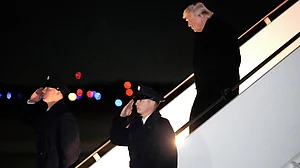 Donald Trump steps off Air Force One, 9 Feb, at Joint Base Andrews
