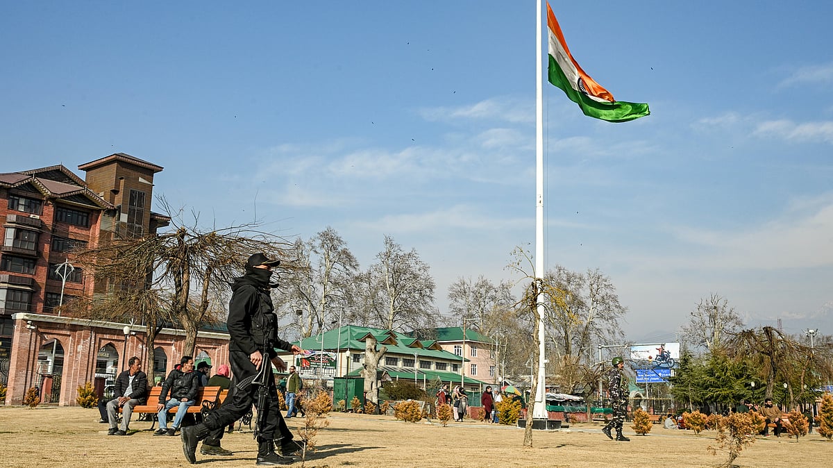 Security personnel stand guard under heightened alert in Srinagar.