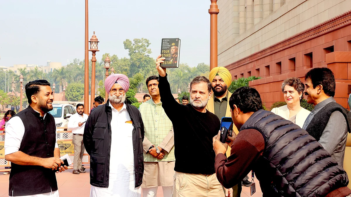 Rahul Gandhi displays the book “no copies of which have been published, distributed or sold...”