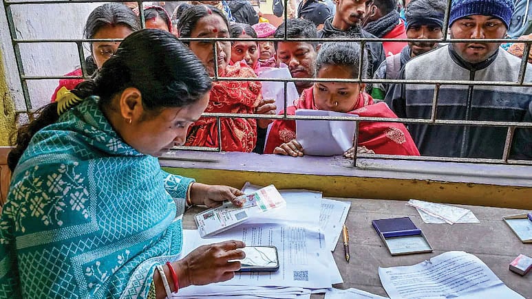 Searching for their names at an election office in Assam