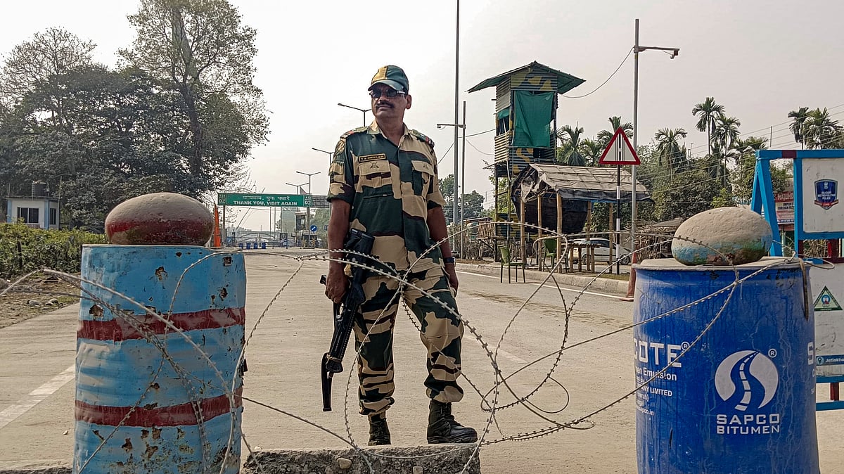 A security personnel stands guard amid heightened tensions in Bangladesh.