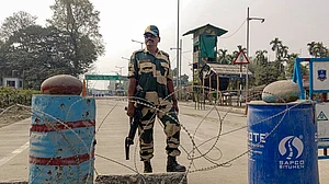 A security personnel stands guard amid heightened tensions in Bangladesh.