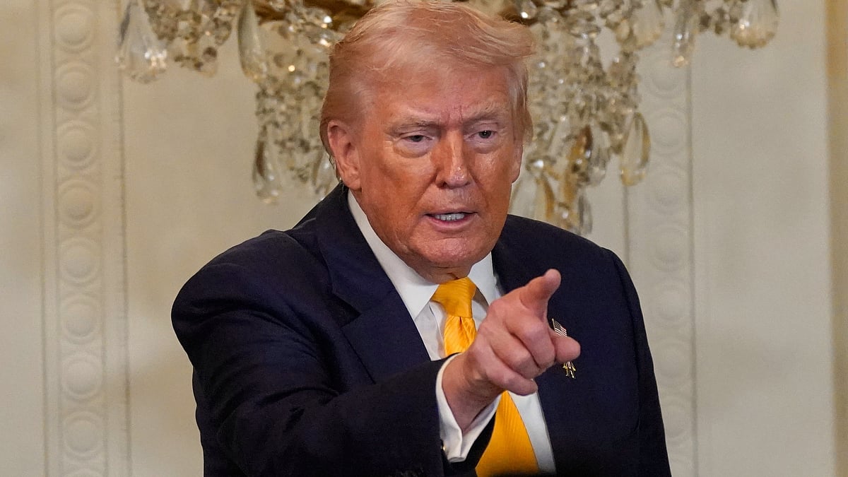 Donald Trump gestures during an event at White House.