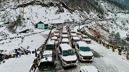 Stranded tourists wait for rescue amid heavy snowfall in the high-altitude areas of East Sikkim.