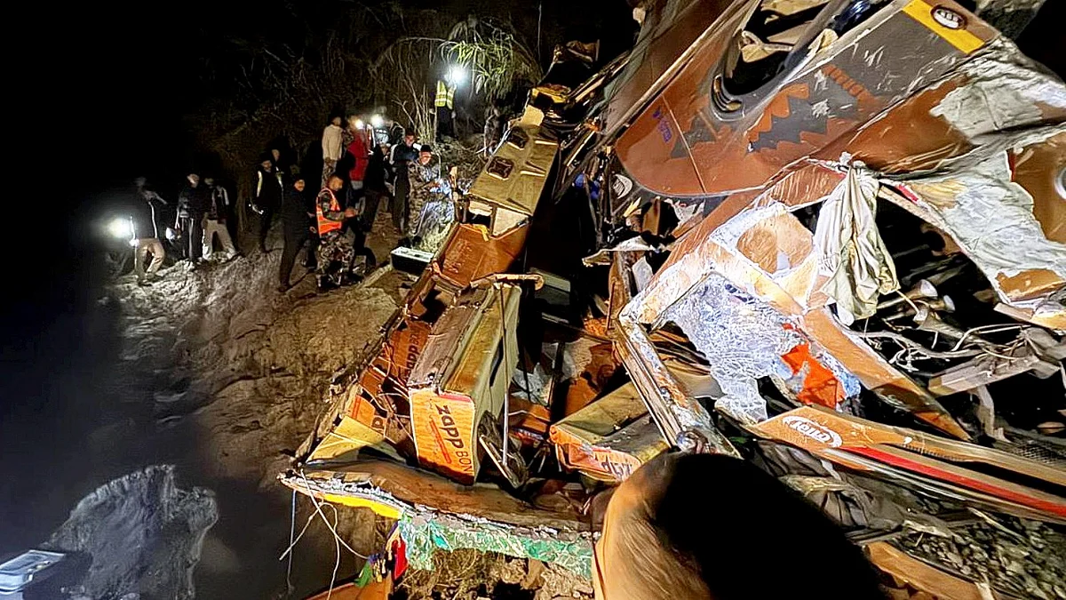 Security personnel carry out rescue operations at the accident site in Dhading, Nepal.