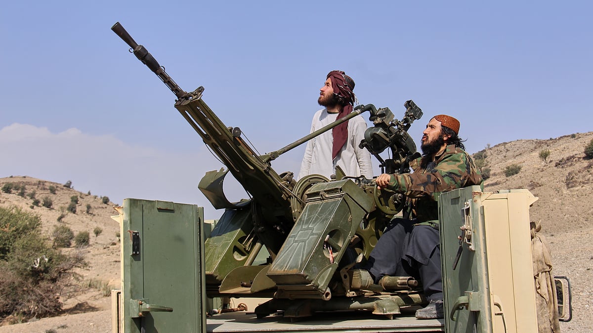 Taliban fighters in an armed pickup truck at a crossing with Pakistan in Khost, Afghanistan, 27 Feb