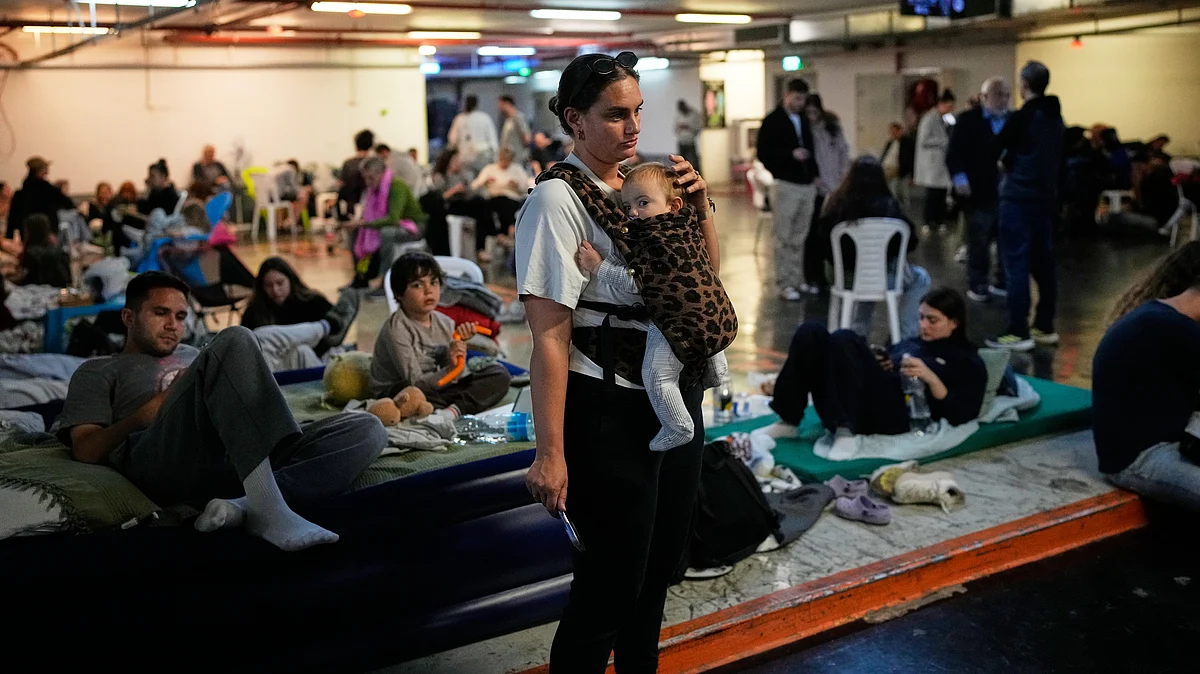 Israelis shelter in a garage as air-raid sirens warn of missiles launched by Iran at Tel Aviv, 1 March