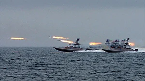IRGC Navy firing projectiles into Strait of Hormuz.