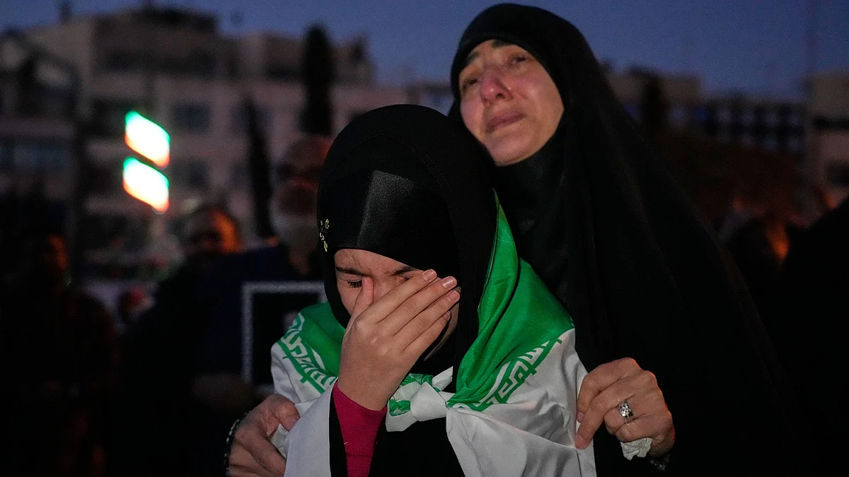 Government supporters mourn in a gathering after state TV officially announced Khamenei's death 