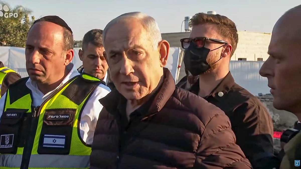 Benjamin Netanyahu surveys the aftermath of an Iranian missile strike in Bet Shemesh.