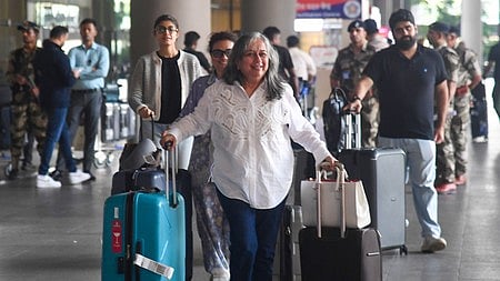 Passengers arrive in New Delhi from Dubai