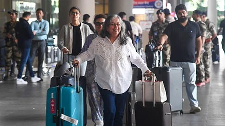 Passengers arrive in New Delhi from Dubai