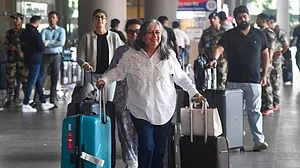 Passengers arrive in New Delhi from Dubai